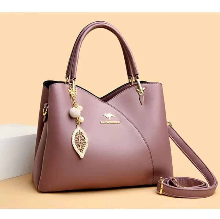 felina™ – black shoulder bag with elegant pendants
