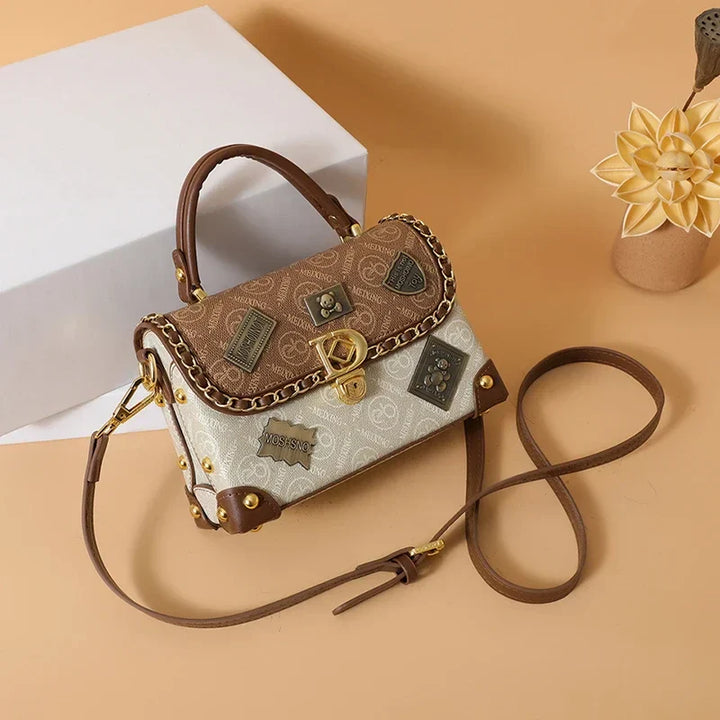 zelda™ – retro shoulder bag with monogram and gold details