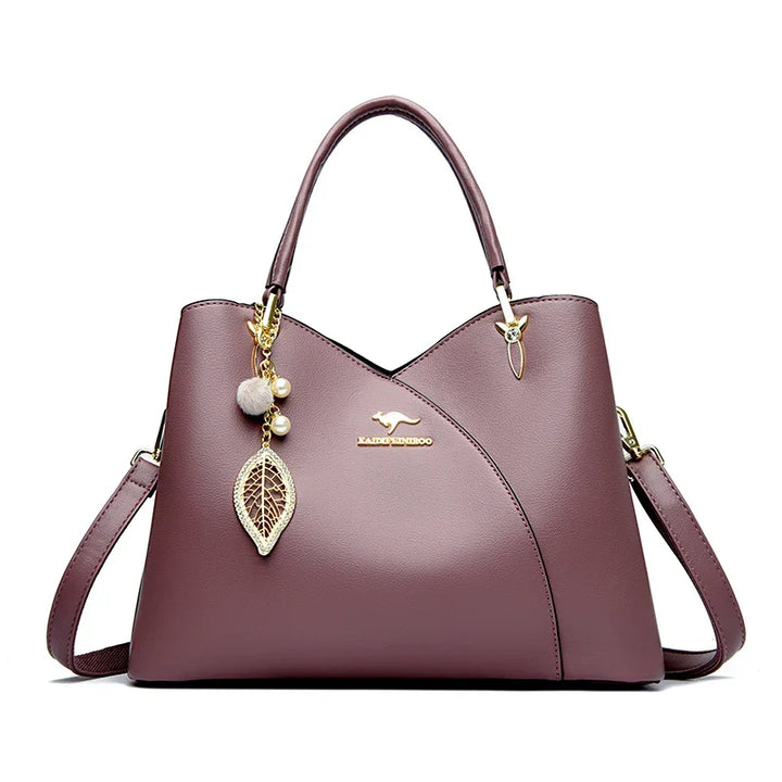 felina™ – black shoulder bag with elegant pendants